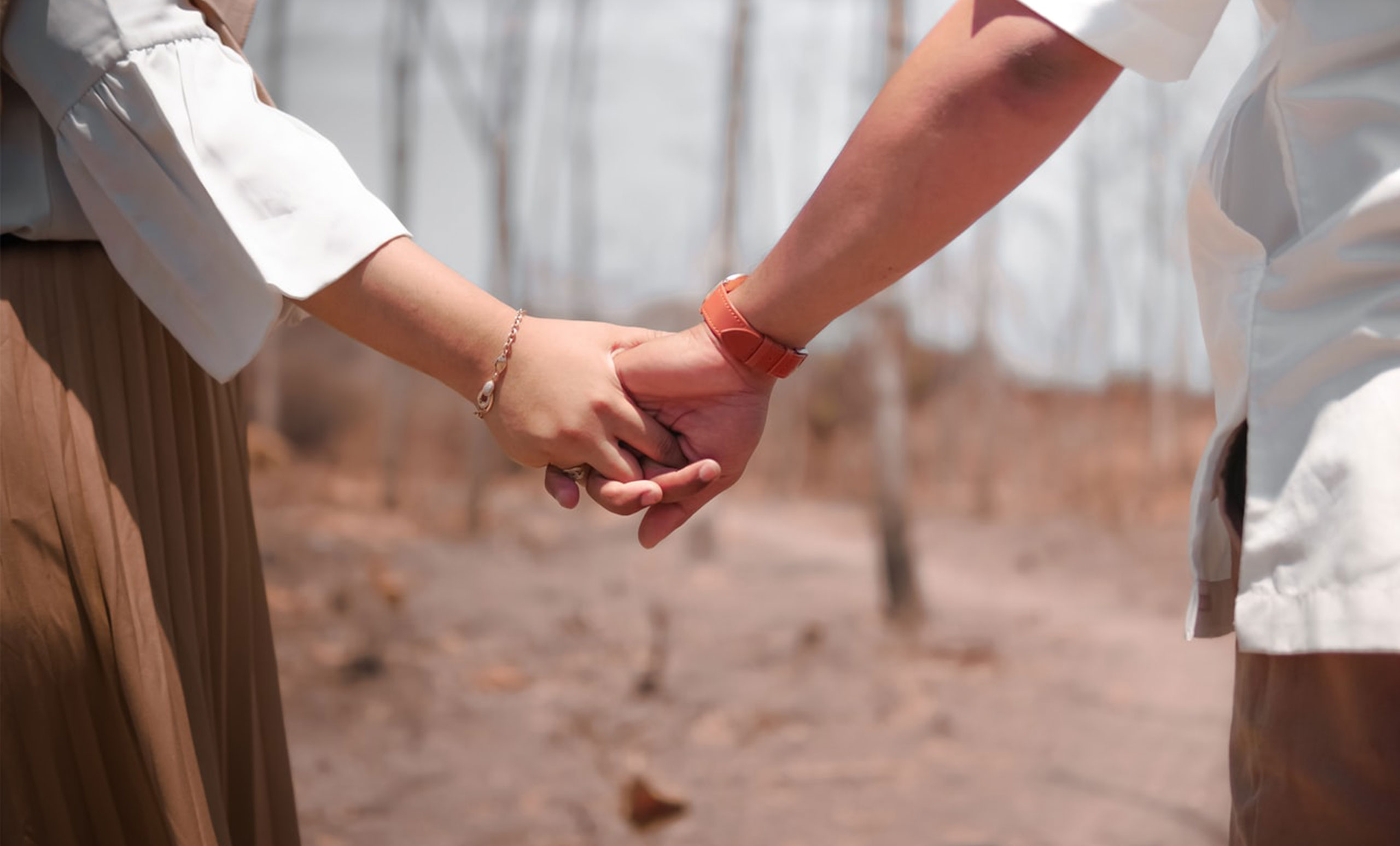 Couple holding hands