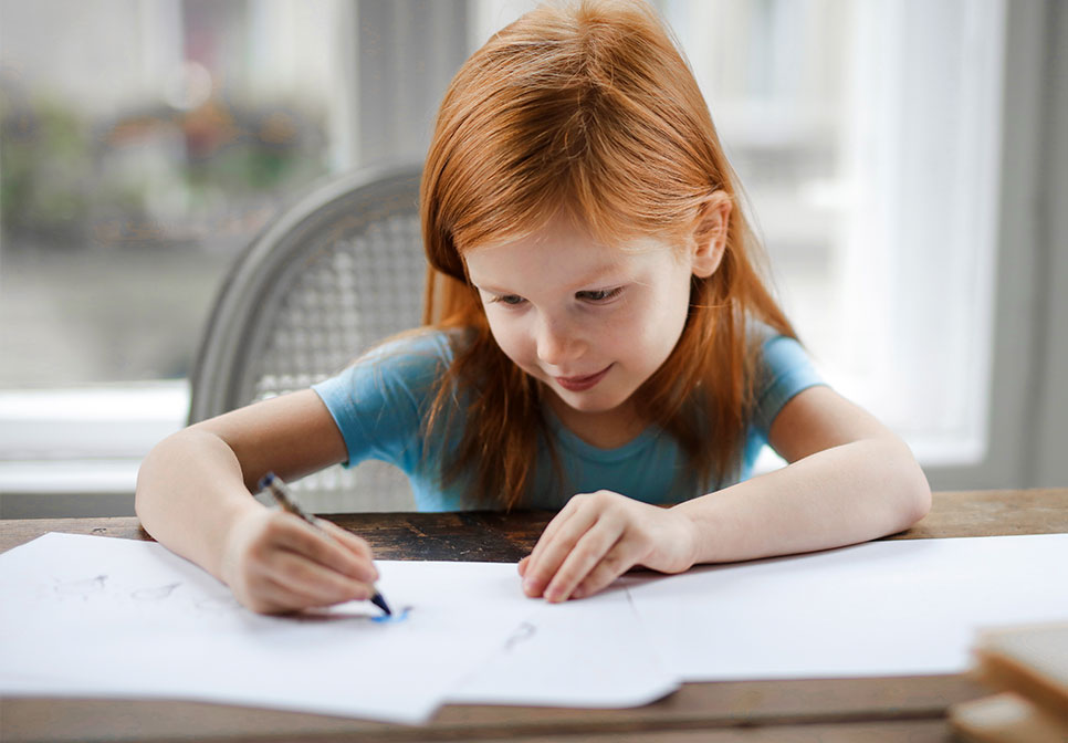 Kid drawing on notebook